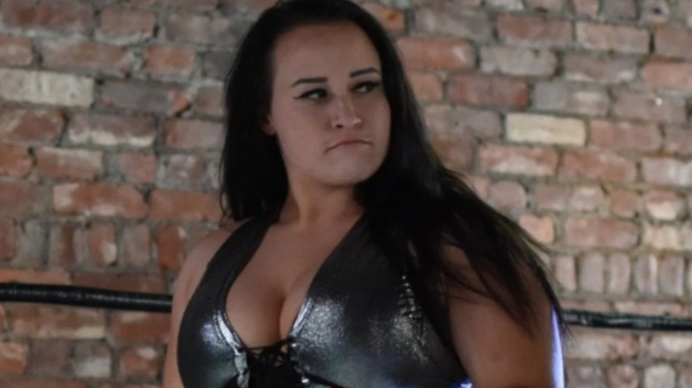 A young Jordynne Grace looks to the crowd while standing in the ring at a Beyond Wrestling event.