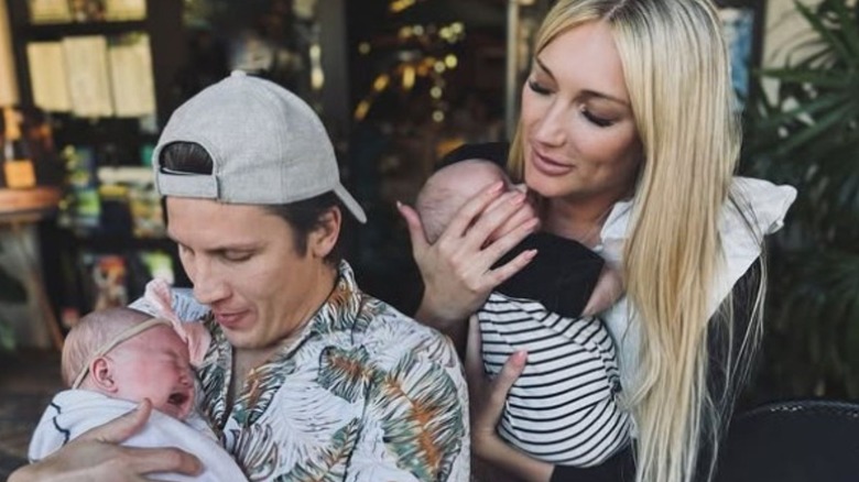 Steve and Brooke Oleksy hold their newborn twins during a lunch outing in a photo posted to Brooke's Instagram.