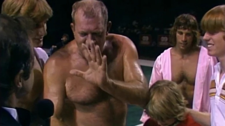 Fritz Von Erich with his sons in the ring