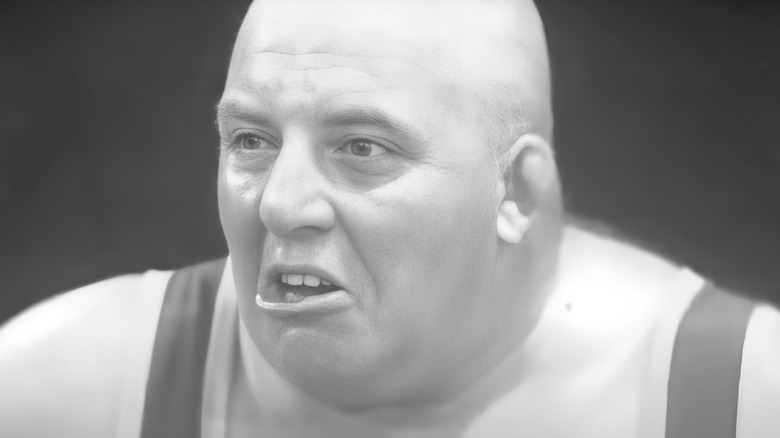 A monochrome photo pf wrestler King Kong Kirk with his mouth open