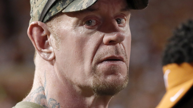 The Undertaker sees someone taking a photo of him
