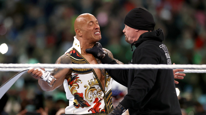 The Undertaker delivers a chokeslam to The Rock at WrestleMania 40