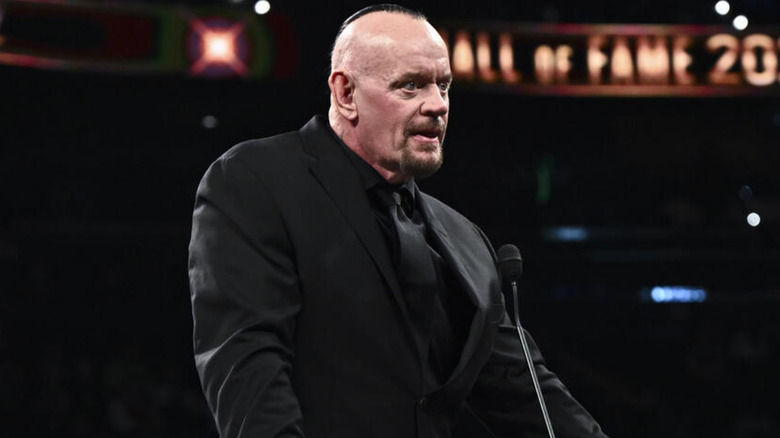 The Undertaker wearing a black suit