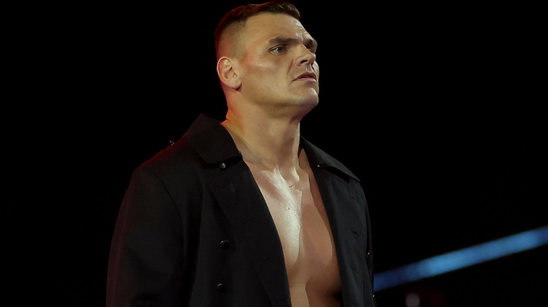 GUNTHER wearing a long, black coat