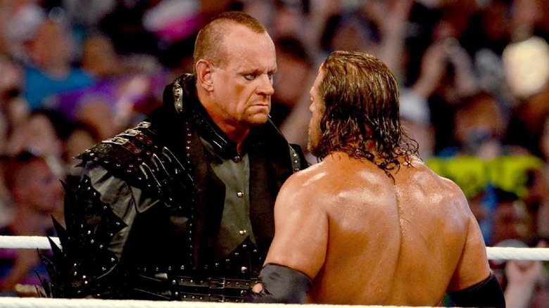 Undertaker Stars Down Triple H at WrestleMania 28