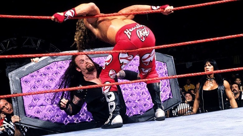 Earl Hebner, The Undertaker, Shawn Michaels, and Chyna at WWE Royal Rumble 1998