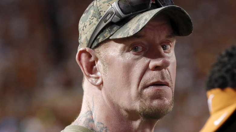 The Undertaker wearing a cap