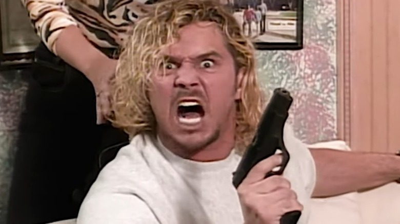 Pillman holds gun