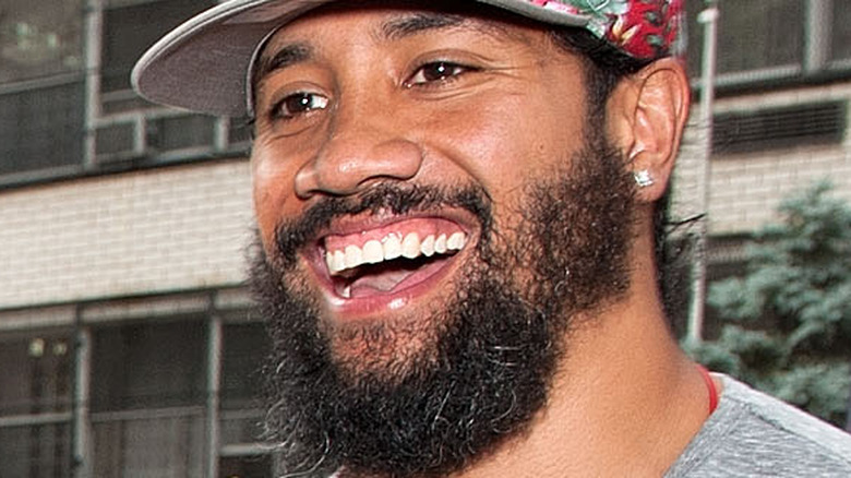 Jey Uso smiling at a press event 