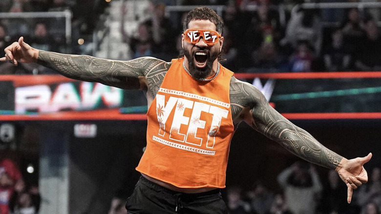 Jey Uso shows some excitement in a matching orange 