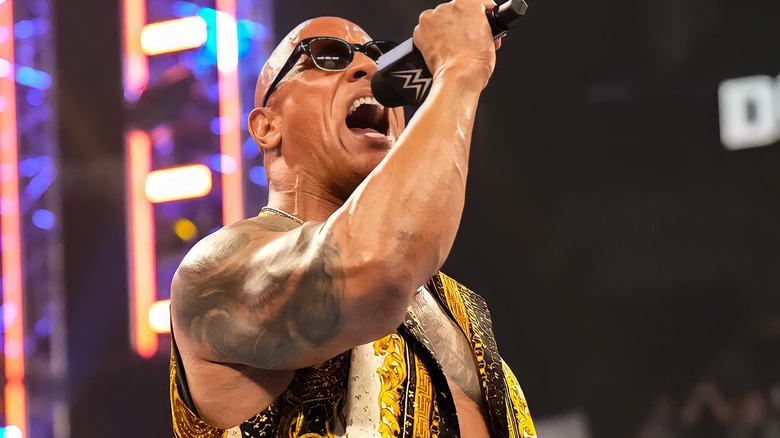 The Rock yelling into microphone