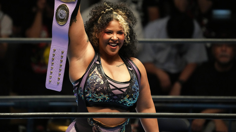 Willow Nightingale holds up title belt