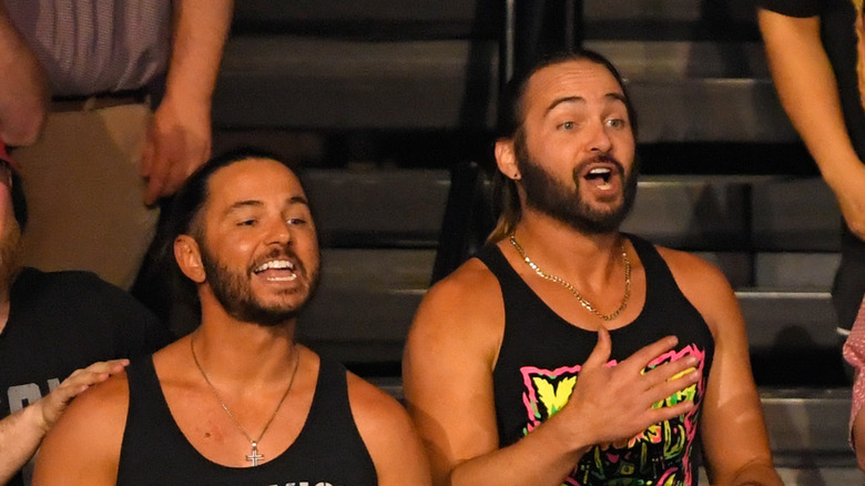 The Young Bucks in the crowd at an AEW event