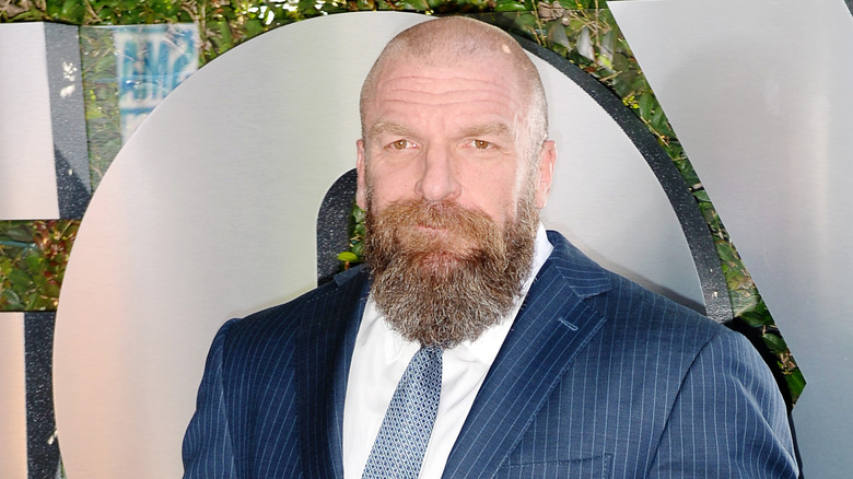 Triple H grinning