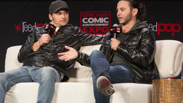 Nick Jackson and Matt Jackson sitting on a couch