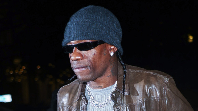 Travis Scott wearing a hat