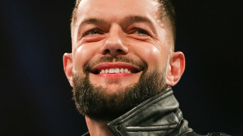 Finn Balor smiling during an entraqnce