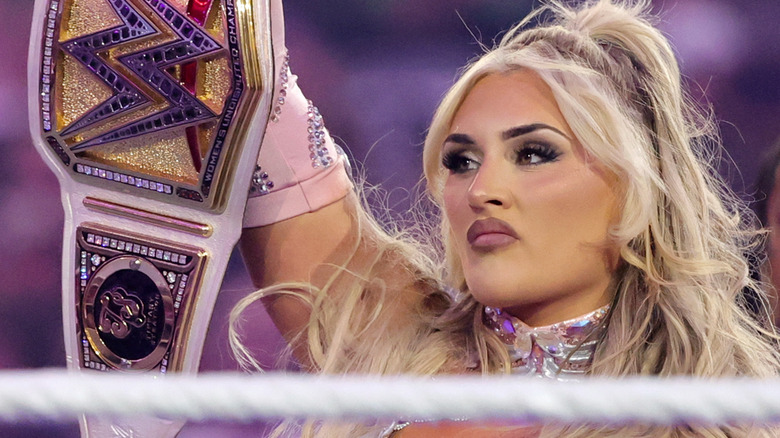 Tiffany Stratton holds up her WWE Women's Championship at WrestleMania 41.