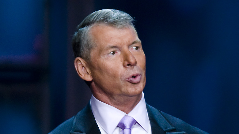 Vince McMahon speaking at a press conference