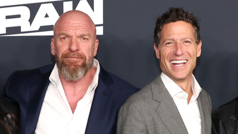 WWE CCO Triple H and TKO President Mark Shapiro pose together ahead of the "WWE Raw" debut on Netflix