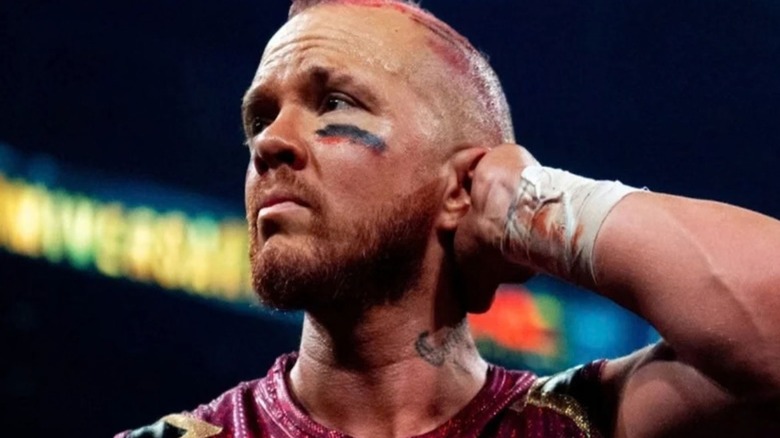 Amazing Red looks to the crowd while recovering in the ring after a match on TNA programming.