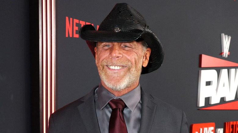 Shawn Michaels wearing a black cowboy hat and smiling