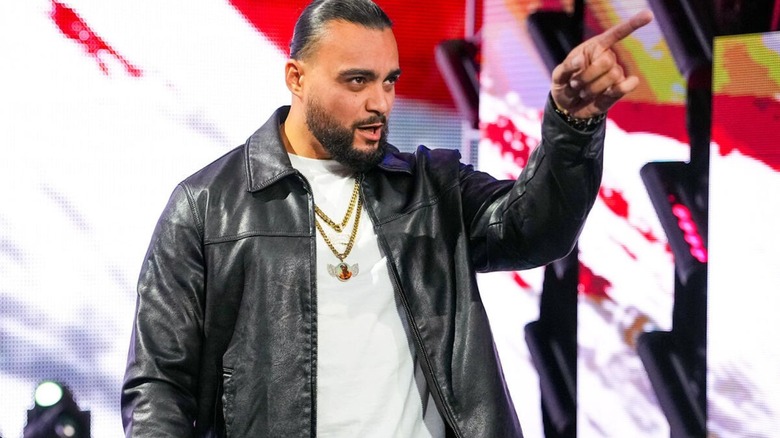 Former TNA World Champion Mike Santana points toward NXT Champion Tony D'Angelo in the ring during his debut in 