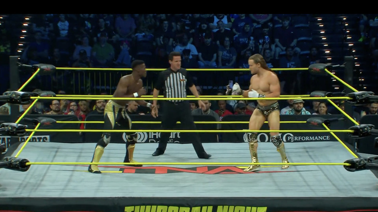 BDE and Mr. Elegance staring down one another in the ring