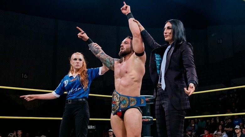 Jason Hotch celebrating International title victory on TNA Impact