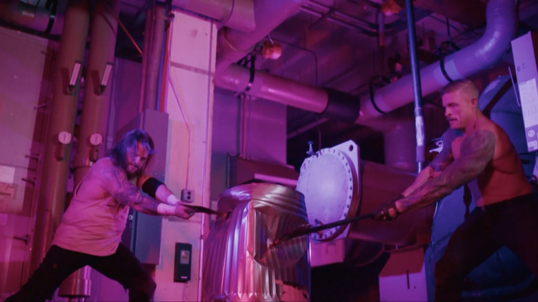 The Syx hit Jeff Hardy with axes while he has a trashcan over his head