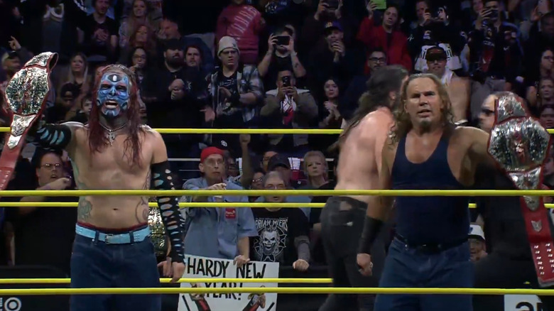 Matt and Jeff Hardy holding the TNA World Tag Team Championship belts