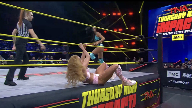 Hartwell in the ring and M on the ring apron