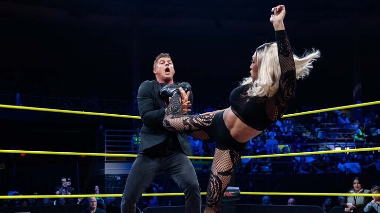 Mara Sada kicks Ryan Nemeth.