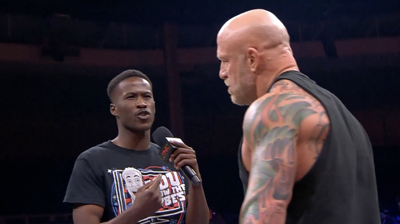 BDE speaking with Eric Young in the ring