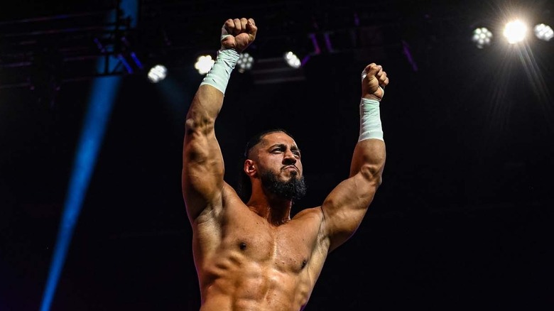 Mustafa Ali raising his arms