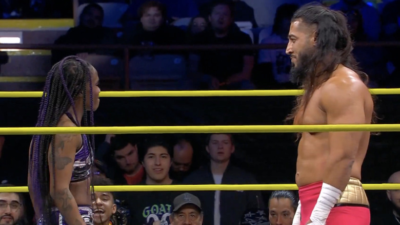 Stone and Ali staring down one another in the ring