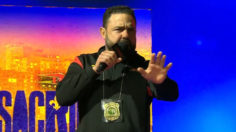 Santino Marella holding up his hand