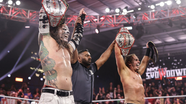 The Hardys holding up their World Tag Team Championship belt
