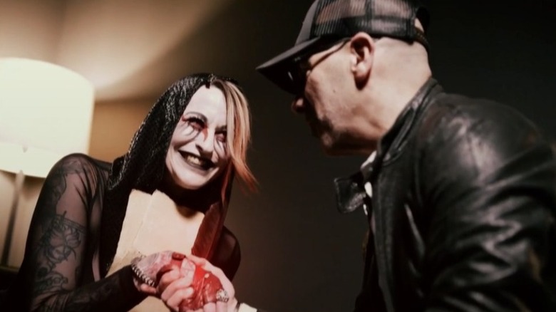 Rosemary shakes the hand of TNA President Carlos Silva