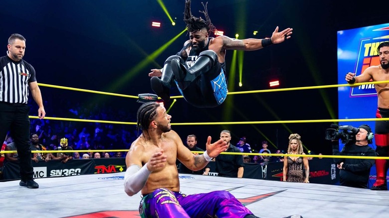 Cedric Alexander delivering a dropkick to Leon Slater in TNA