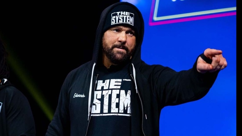 Eddie Edwards points at the fans making his way down the entrance ramp