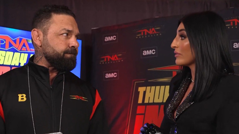 Santino Marella looking at Daria Rae