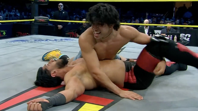 Starboy Charlie attempting a pin on Mustafa Ali