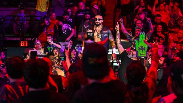 Mike Santana gets swarmed by the love and admiration of the Syracuse, New York crowd