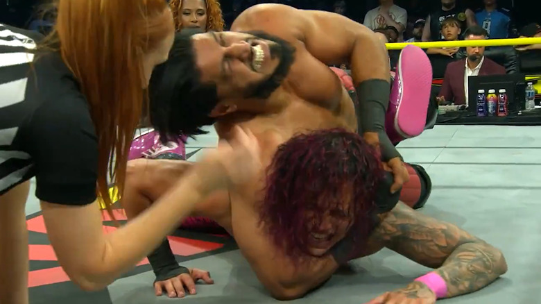 Mustafa Ali holds KC Navarro in a submission