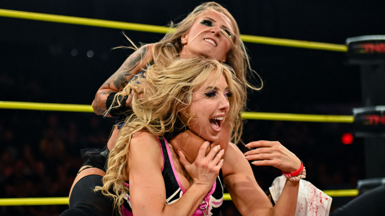 Heather By Elegance holding Allie in a headlock