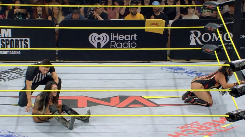 Black and Choo both down in the ring