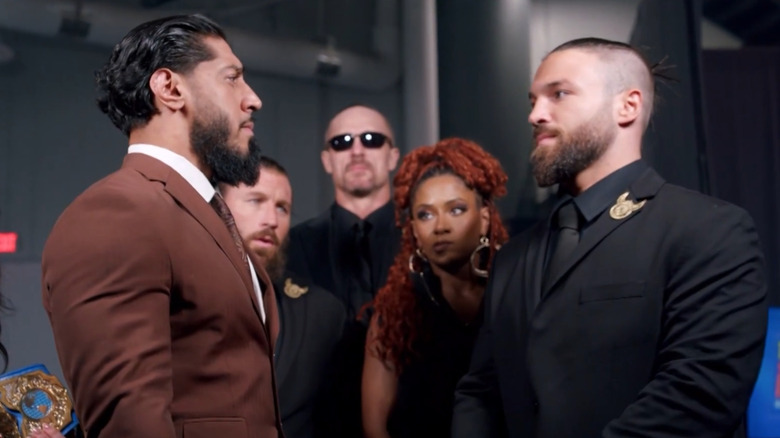 Mustafi Ali and Jason Hotch facing off backstage in TNA