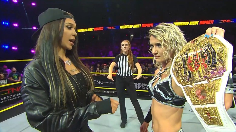 Elayna Black stares Xia Brookside down in the ring as Brookside holds the Knockouts World Championship in her hands