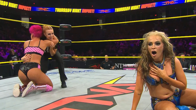 Harley Hudson celebrating while Alisha Edwards is shocked on TNA Impact
